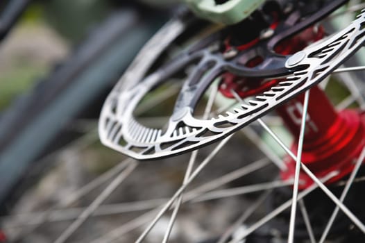 disc brakes on a bicycle wheel close-up. mountain bike detail close up.