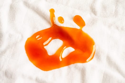 Dirty tomato sauce stain or ketchup on cloth to wash with washing powder, cleaning housework concept.