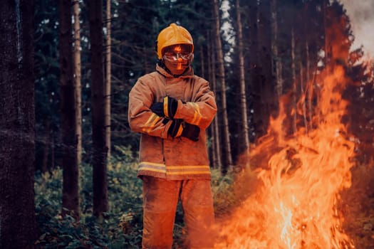 Firefighter at job. Firefighter in dangerous forest areas surrounded by strong fire. Concept of the work of the fire service. H