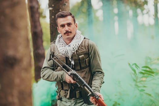 Angry terrorist militant guerrilla soldier warrior in forest.