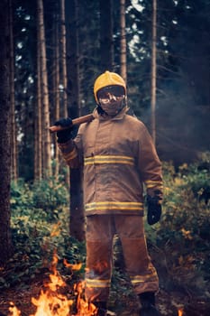 Firefighter at job. Firefighter in dangerous forest areas surrounded by strong fire. Concept of the work of the fire service. H