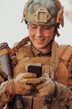Soldier using smartphone to contact family or girlfriend communication and nostalgia concept.