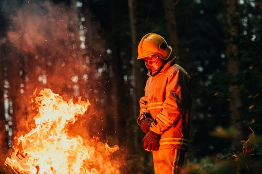 Firefighter at job. Firefighter in dangerous forest areas surrounded by strong fire. Concept of the work of the fire service. H