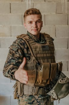 I choose you. A soldier with an outstretched hand towards the camera shows that he chooses you for support and partnership in warfare.