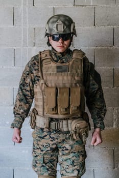 Soldier preparing tactical protective and communication gear for action battle.