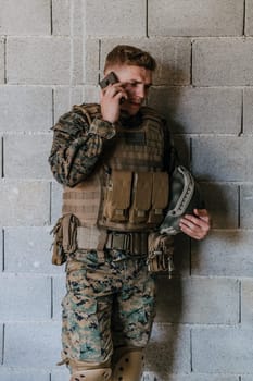 Soldier using smartphone and calling home family and frinds.