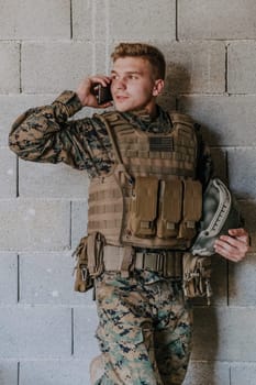 Soldier using smartphone and calling home family and frinds.