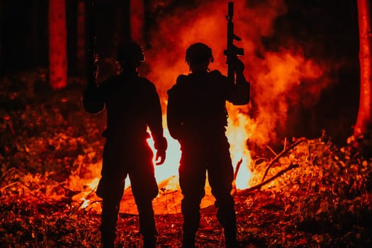 Special marines military forces squad soldiers group portrait after finished mission complete fire in background.