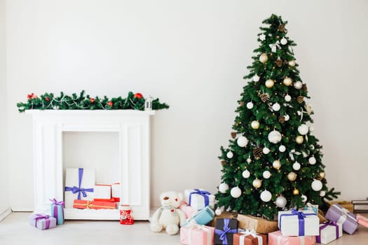 Christmas tree with gifts in the new year decor interior