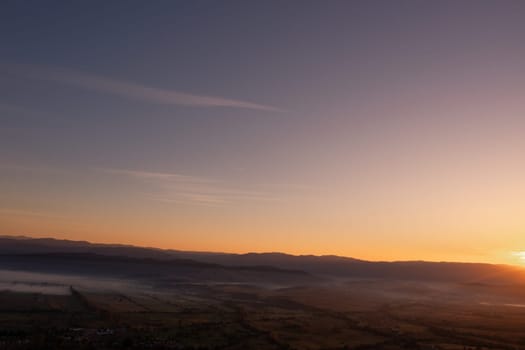 aerial view of foggy morning autumn mountains with clouds bansko bulgaria.