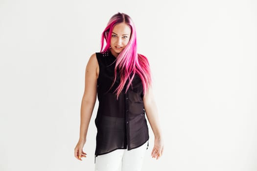 nice girl with the pink hair posing on a white background