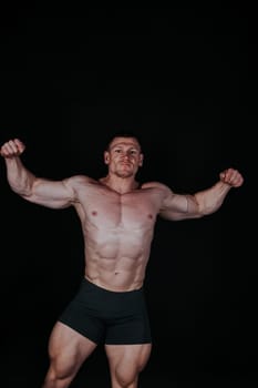 Sport the athlete bodybuilder shows off his muscles 2