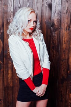 blonde girl with red lips is a wooden wall 1