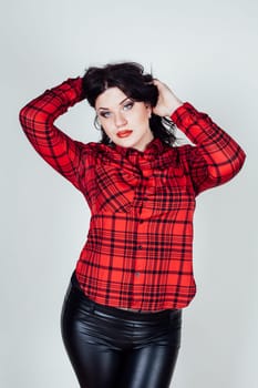 fat girl in a red shirt posing in the Studio 1