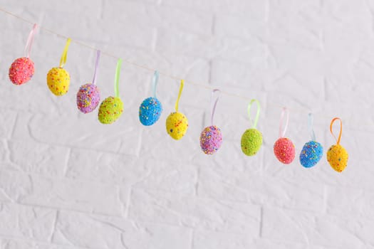 Easter eggs painted in pastel colors on a white background