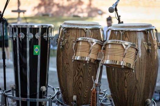Close-up of drums set against the vibrant backdrop of a live concert stage.