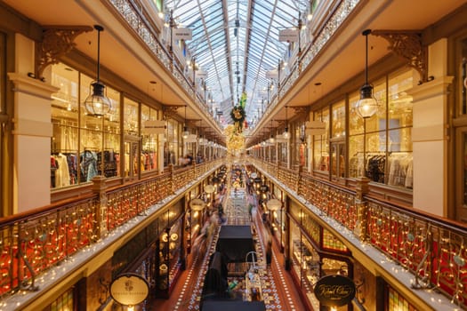 SYDNEY, AUSTRALIA DECEMBER 3 2023 - The Strand Arcade with Christmas lights and decorations in the middle of a busy day in Sydney CBD, New South Wales, Australia