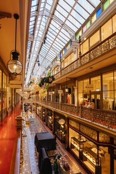 SYDNEY, AUSTRALIA DECEMBER 3 2023 - The Strand Arcade with Christmas lights and decorations in the middle of a busy day in Sydney CBD, New South Wales, Australia