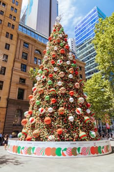 SYDNEY, AUSTRALIA DECEMBER 3 2023: Martin Place with Christmas tree, lights and decorations in the middle of a busy day in Sydney CBD, New South Wales, Australia