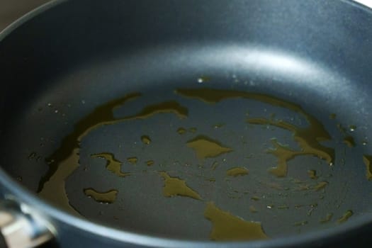 Frying Pan With Avocado Oil, Avocado, and Healthy Food. Selective focus