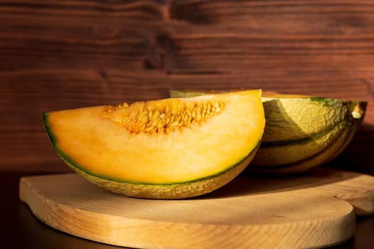 Orange melon harvested in the greenhouse of an organic fruit farm. Favorite fruits in summer.