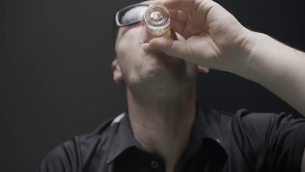 Men's rest.Action.A man in dark glasses plays poker, and drinks alcohol tinctures with passion. High quality 4k footage