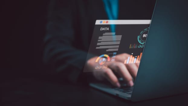 Business people use computers to analyze business and manage corporate data, business analytics with charts, metrics and KPIs to improve organizational performance, marketing, financial organization strategy.