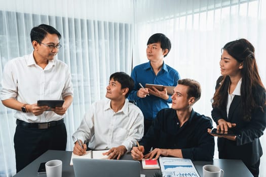 Group of diverse office worker employee working together on strategic business marketing planning in corporate office room. Positive teamwork in business workplace concept. Prudent