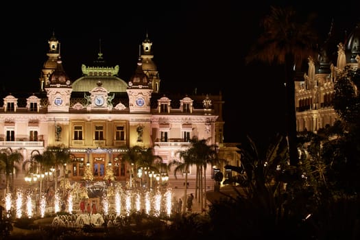 Monaco, Monte-Carlo, 12 November 2022: Festive fireworks at a wedding celebration on the square of the famous Casino Monte-Carlo is at night, attraction night illumination. High quality photo