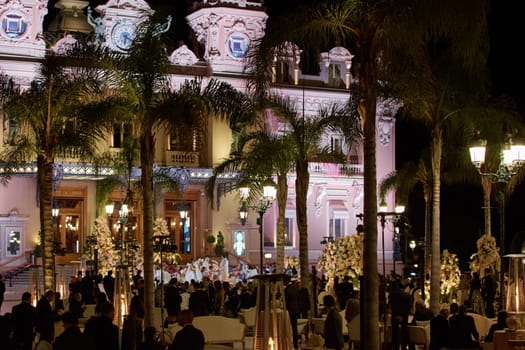 Monaco, Monte-Carlo, 12 November 2022: The Indian wedding celebration in the square of the famous Casino Monte-Carlo is at night, attraction night illumination. High quality photo