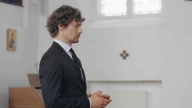 A handsome,worried man. Action.The groom in a suit in the wedding hall shifts his hands from nerves. High quality 4k footage