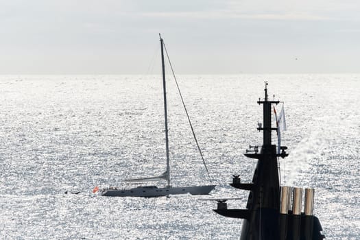 Monaco, Monte Carlo, 27 September 2022 - top of huge luxury yacht at sunny day, sailing yacht on background, the famous motorboat exhibition in the principality. High quality photo