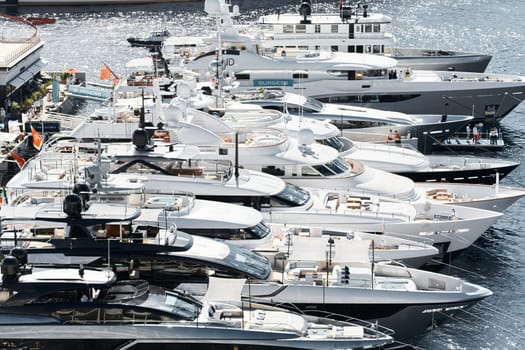 Monaco, Monte Carlo, 27 September 2022 - a lot of luxury yachts at the famous motorboat exhibition in the principality, the most expensive boats for the richest people around the world, yacht brokers. High quality photo