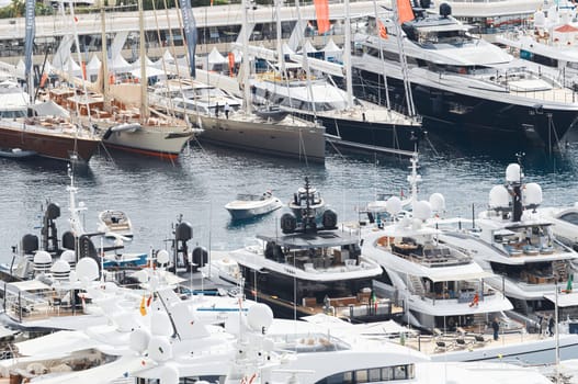 Monaco, Monte Carlo, 27 September 2022 - a lot of luxury yachts at the famous motorboat exhibition in the principality, the most expensive boats for the richest people around the world, yacht brokers. High quality photo