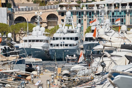 Monaco, Monte Carlo, 27 September 2022 - a lot of luxury yachts at the famous motorboat exhibition in the principality, the most expensive boats for the richest people around the world, yacht brokers. High quality photo