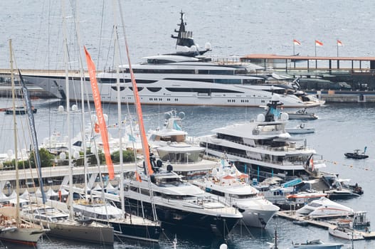 Monaco, Monte Carlo, 27 September 2022 - a lot of luxury yachts at the famous motorboat exhibition in the principality, the most expensive boats for the richest people around the world, yacht brokers. High quality photo