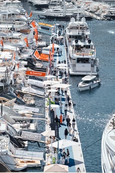 Monaco, Monte Carlo, 27 September 2022 - a lot of luxury yachts at the famous motorboat exhibition in the principality, the most expensive boats for the richest people around the world, yacht brokers. High quality photo