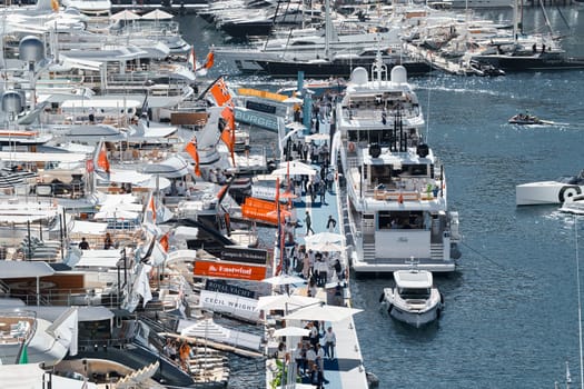 Monaco, Monte Carlo, 27 September 2022 - a lot of luxury yachts at the famous motorboat exhibition in the principality, the most expensive boats for the richest people around the world, yacht brokers. High quality photo