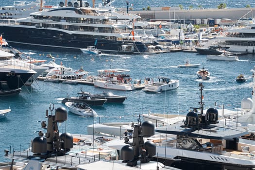 Monaco, Monte Carlo, 27 September 2022 - a lot of luxury yachts at the famous motorboat exhibition in the principality, the most expensive boats for the richest people around the world, yacht brokers. High quality photo