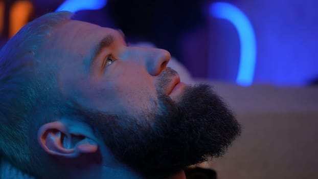 Man lies on the couch and looks up. High quality photo