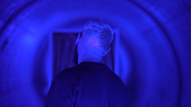 Neon light studio close-up portrait of serious man model . High quality photo