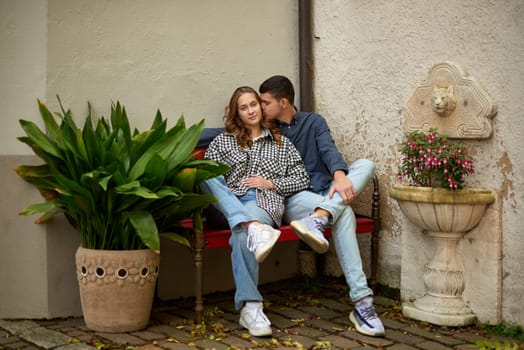 Young Cute Female Hugs Boyfriend. In Autumn Outdoor. Lovers Walking in Park. Attractive Funny Couple. Lovestory in Forest. Man and Woman. Cute Lovers in the Park. Family Concept. Happy Couple.