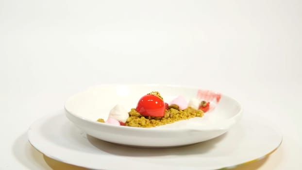 Dessert on the plate on white background. Beautiful delicious dessert on the plate. The presentation of the desserts in the United Arab Emirates.