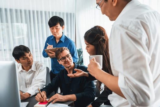 Group of diverse office worker employee working together on strategic business marketing planning in corporate office room. Positive teamwork in business workplace concept. Prudent