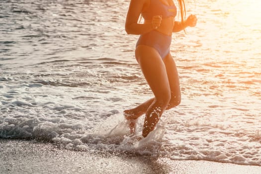 Running woman. Female runner jogging during the sunrise on beach. Woman Runner feet running on the beach at sunrise. woman fitness sunrise jog workout wellness concept.