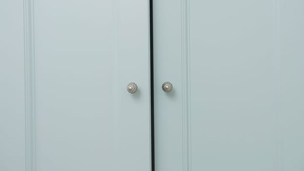 Close-up of light cabinet closes. Creative. doors of large wardrobe are closing. Doors of large cabinet slowly close.