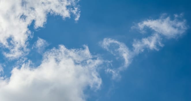 Background of blue sky with beautiful natural white clouds.