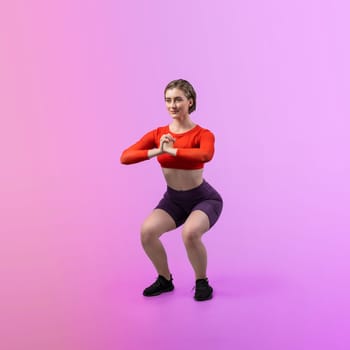 Full body length gaiety shot athletic and sporty young woman with fitness in squat exercise posture on isolated background. Healthy active and body care lifestyle.