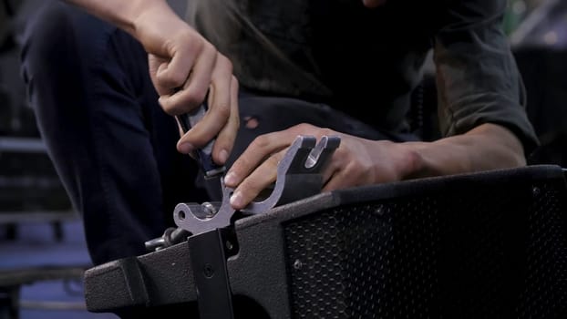 Close up of hands screwing together furniture pieces. Man screwing a screw with screwdriver 4K