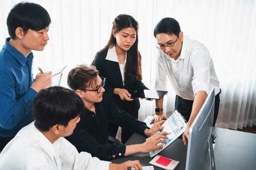 Group of diverse office worker employee working together on strategic business marketing planning in corporate office room. Positive teamwork in business workplace concept. Prudent